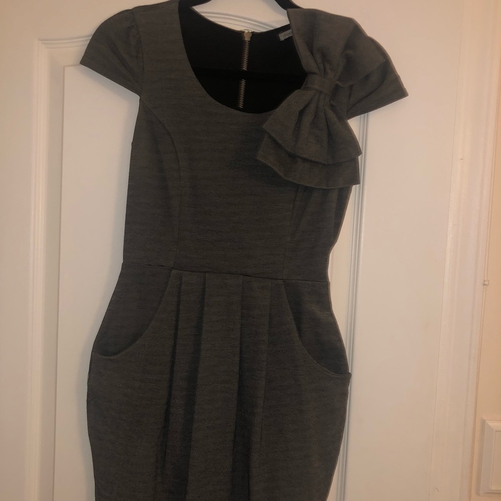 Dressed with bow and pockets